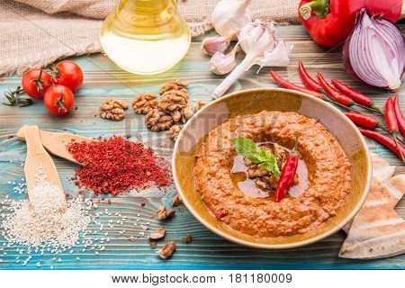 Traditional hot pepper, tomato paste, walnut, sesame paste, onions and garlic dish