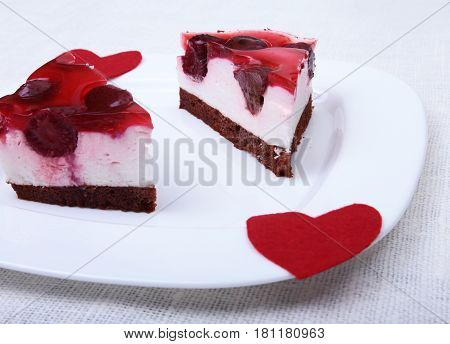Slice of handmade cherry pie on a plate and classic espresso coffee in white background.