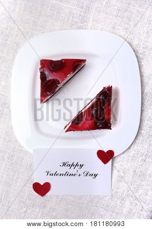 Slice of handmade cherry pie on a plate and classic espresso coffee in white background.