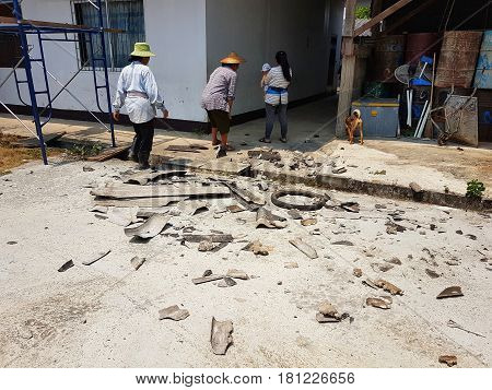 CHIANG RAI THAILAND - MARCH 29 : unidentified people working on the cement ground with broken roof on March 29 2017 in Chiang rai Thailand.