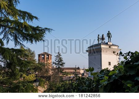 Statues with clock on Loggia di San Giovanni in Udine Italy