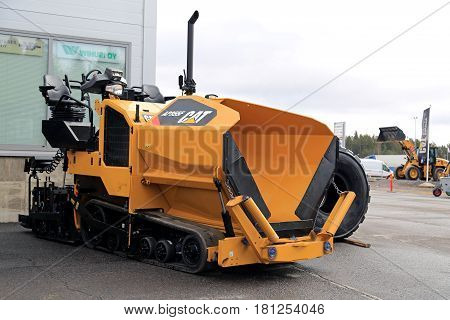 LIETO FINLAND - MARCH 25 2017: Cat AP355F asphalt paver seen at the annual public event of Konekaupan Villi Lansi Machinery Sales.