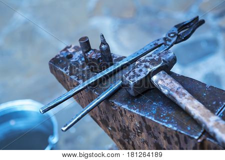 Metal fabricator utilizing a torch to heat up a piece of metal in order to shape it utilizing a forging technique developed over hundred years ago.