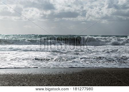 seascape showing powerful waves shot on cloudy day landscape layout