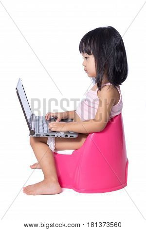 Asian Chinese Little Girl Sitting On Chamberpot With Laptop
