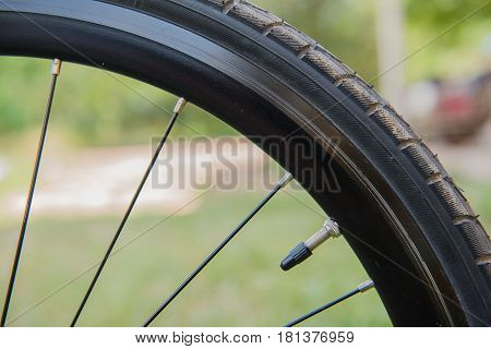 Closeup black Bicycle tire. bike wheel fragment.