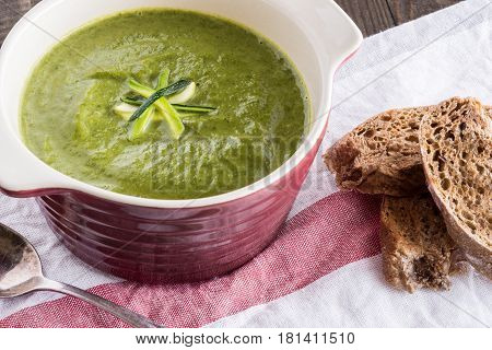 Spinach and Zucchini Cream Soup in a Bowl. Homemade Spinach Pottage Puree.