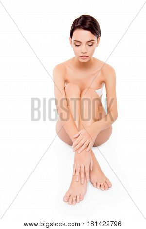 Young Pretty Girl Sitting On The Floor With Mooth Legs