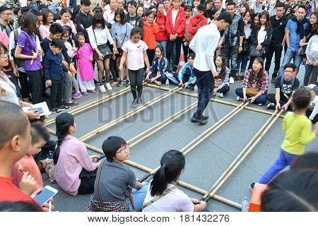 Hanoi Vietnam - Feb 19 2107 : People playing Bamboo clapping at Hanoi Night Market on Hang Dao Walking Street