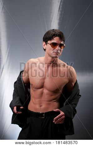 the macho man is revealing his hot body.