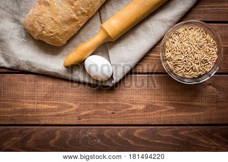 Baking fresh homemade bread on wooden kitchen table background top view moke up
