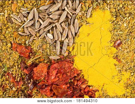 Zira seeds with crushed dried chillies and curry