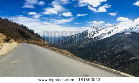DEQIN CHINA - APR 15 2015: The empty road to Deqin a famous landscape in Deqin Yunnan China.