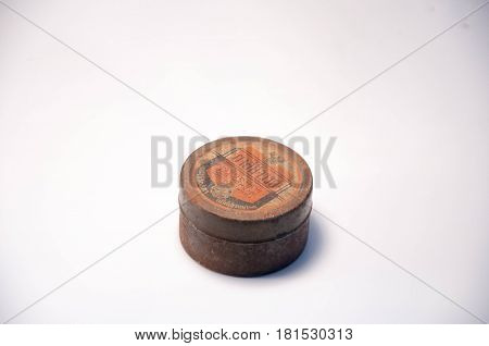 Thailand. April 09 2017 : An Old round steel case. The Thai wording on case meaning is Miracle medicine. 09 Apil 2017. Thailand.