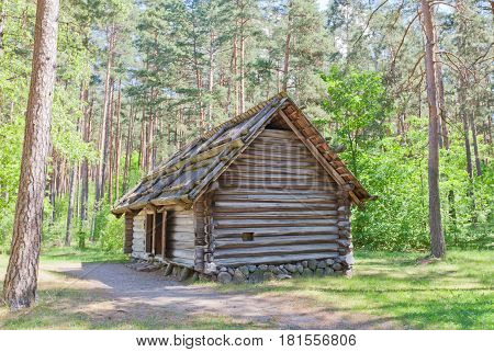 RIGA LATVIA - JUNE 13 2016: Bathhouse with summer kitchen (circa 1840s) of Koderi farmstead of Vidzeme ethnic group. Exhibited in Ethnographic Open-Air Museum of Latvia since 1933