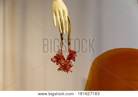 PARIS FRANCE - MARCH 27 2017: Details of the shop window decoration in the Printemps department store in Paris France. Bijouterie in the hand of a dummy.
