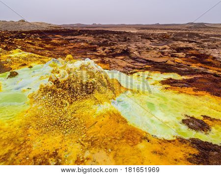 Sulphur lake Dallol in a volcanic explosion crater in the Danakil Depression northeast of the Erta Ale Range in Ethiopia. The lake with its sulphur springs is the hottest place on Earth.