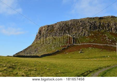 Pastures outlined by rock walls on Neist Point in Scotland.