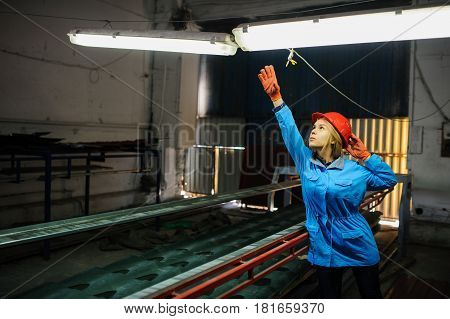 Woman In Red Safety Helmet Work As Industrial Worker