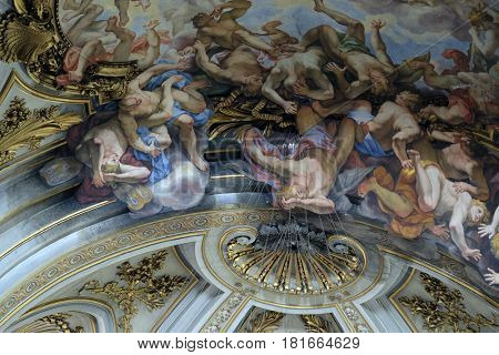 ROME, ITALY - SEPTEMBER 04: The ceiling fresco of The Fall of the Rebelious Angels in church dei Santi XII Apostoli in Rome, Italy on September 04, 2016.