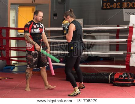 CRACOW POLAND - FEBRUARY 12 2016: Agnieszka Niestoj - talented Polish boxer durning boxing training with coach in the gym. Cracow Poland