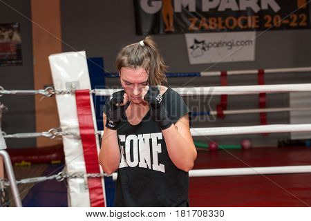 CRACOW POLAND - FEBRUARY 12 2016: Agnieszka Niestoj - talented Polish boxer durning boxing training with coach in the gym. Cracow Poland