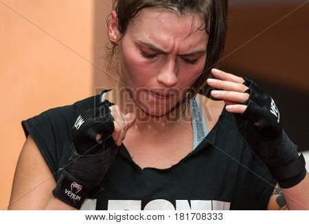 CRACOW POLAND - FEBRUARY 12 2016: Agnieszka Niestoj - talented Polish boxer durning boxing training with coach in the gym. Cracow Poland