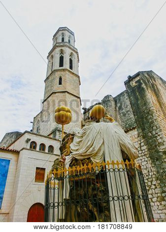 Figueres, Spain - September 15, 2015: The Monument to the Catalan philosopher Francesc Puzholsu in front of the theater and the museum of Salvador Dali in Figueres, Spain on September 15, 2015