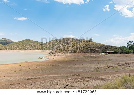 STOMPDRIFT SOUTH AFRICA - MARCH 23 2017: The holiday resort and nearly empty Stompdrift dam near De Rust in the Western Cape Province