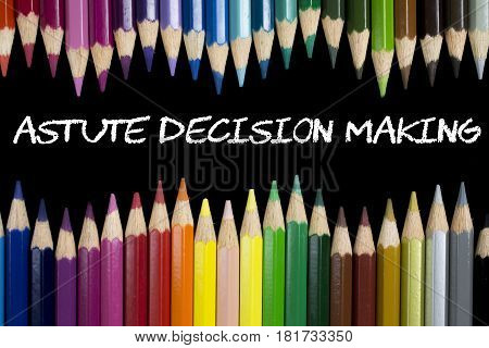 Colorful pencil crayons with text Astute Decision Making on black background