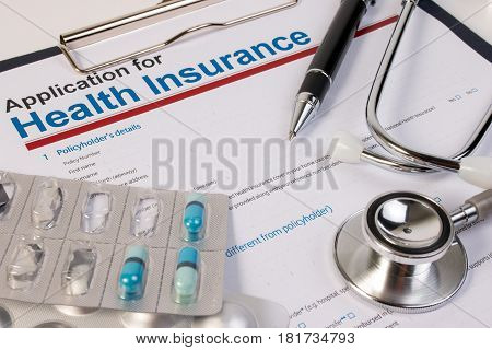 Application Form For Health Insurance, Paperwork, Questionnaire, Pen, Tablet And Stethoscope. Health