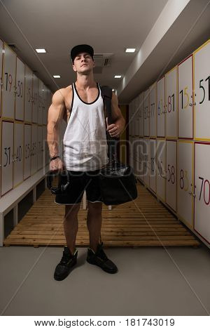 Fit Man Changing Clothings In Locker Door