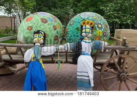 Kiev Ukraine - May 11 2016: Traditional dolls - motanki and Easter eggs in festive decorations on the Mikhaylovskaya square