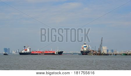 Cargo Ships On The Saigon River In Southern Vietnam