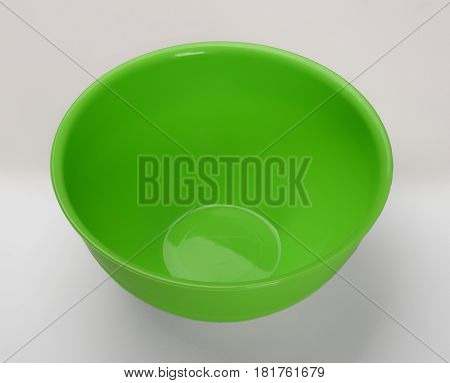 Green plastic deep dish isolated on wjite background