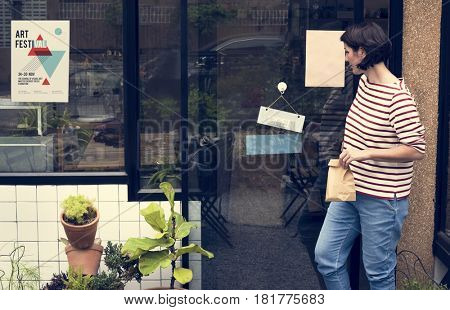 Woman shopping at cafe holiday