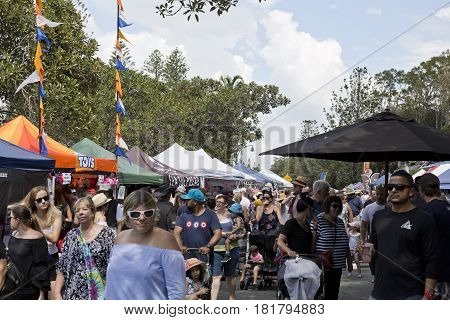 REDCLIFFE, AUSTRALIA - APRIL 14, 2017: Crowds converged into Suttons Beach during the Redcliffe Festival of Sails an annual event which takes place on Good Friday
