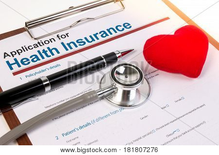 Application Form For Health Insurance, Paperwork, Questionnaire With Pen, Heart And Stethoscope. Hea