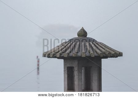 Traditional chinese lantern on the West Lake in Hangzhou. Misty landscape