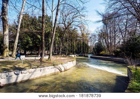 Munich Bavaria Germany.- March 28 2017. View of Schwabinger Bach at the Englischer Garten in Munich