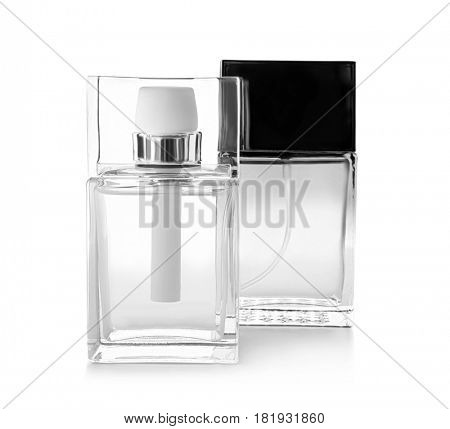 Bottles of modern male perfume on white background