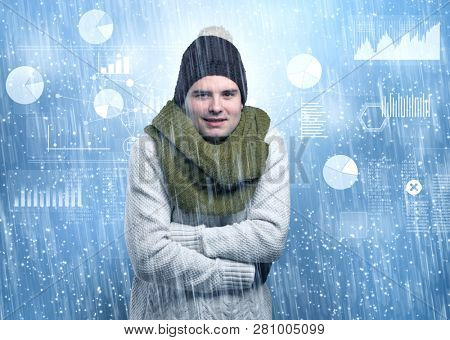 Young businessman shivering with graphs, reports and chart concept
