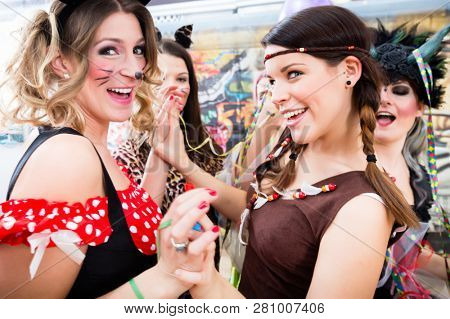 Group of young German women at fasching carnival having costume party