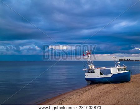 Fishing Boat On Baltic Sea Coast. Stormy Weather. Mechelinki, Poland, Pucka Bay.