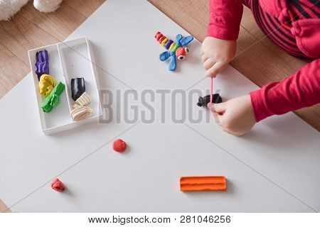 Baby Girl Toddler Playing And Learning With Plastilin. Development Of Fine Motor Skills, Childrens S