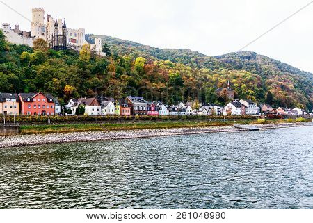 A Long Row Of Picturesque Houses On The Rhine Shore Beneath The Castle Stolzenfels In Historic City 