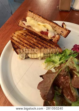 Turkish Tost / Toast Sandwich With Melted Cheese And Suck / Sujuk Served With Salad.