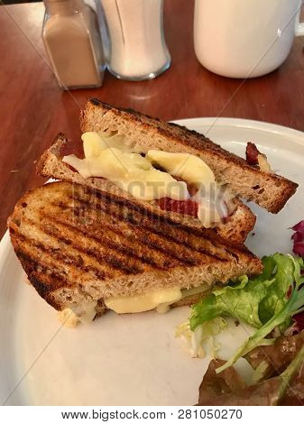 Turkish Tost / Toast Sandwich With Melted Cheese And Suck / Sujuk Served With Salad.