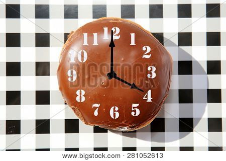 Donut Clock. Chocolate Donut with a clock face. Donut Time. Snack Time. 