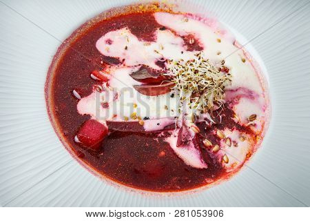 Macro Ukrainian Borscht Decorated With Sour Cream And Wheat Sprouts